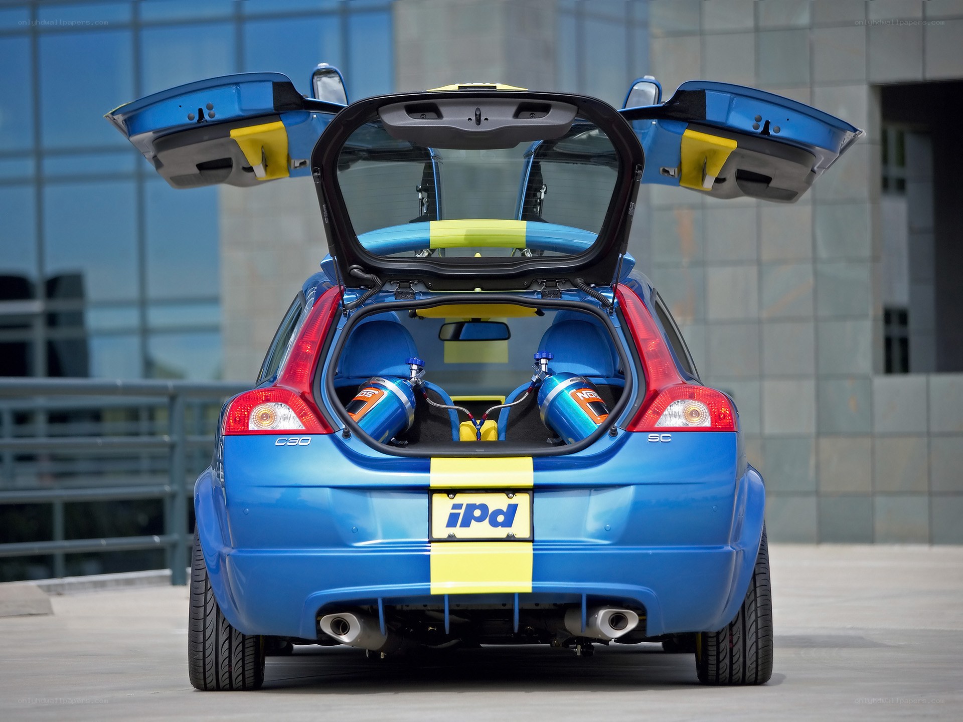 blue volvo c30 with open doors