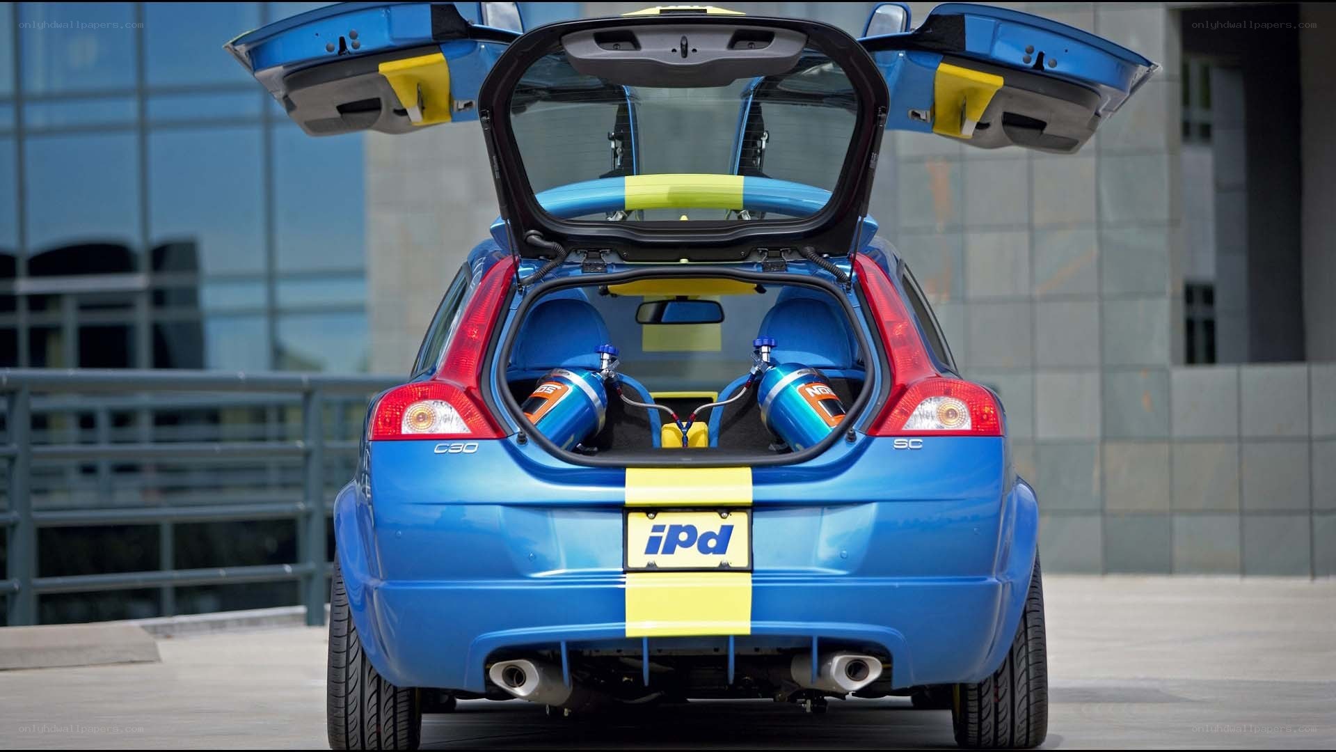 blue volvo c30 with open trunk