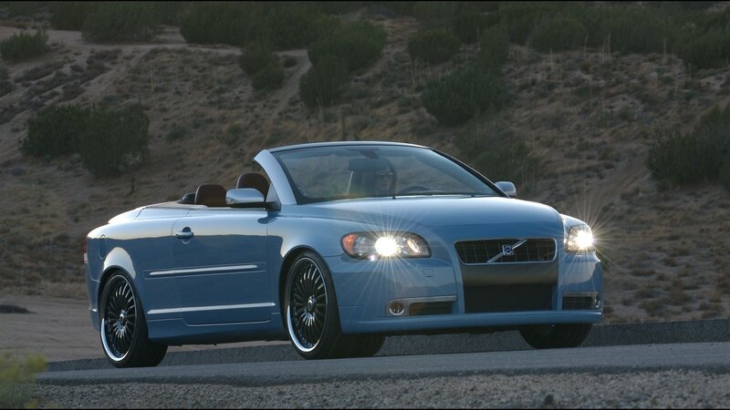 Blue Volvo Convertible on Road