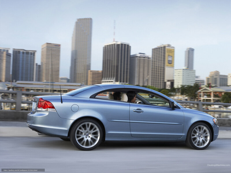 blue volvo coupe in city