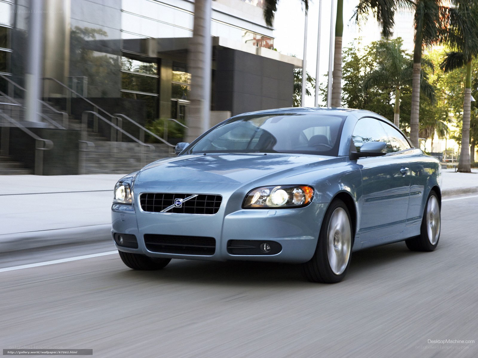 blue volvo coupe in motion