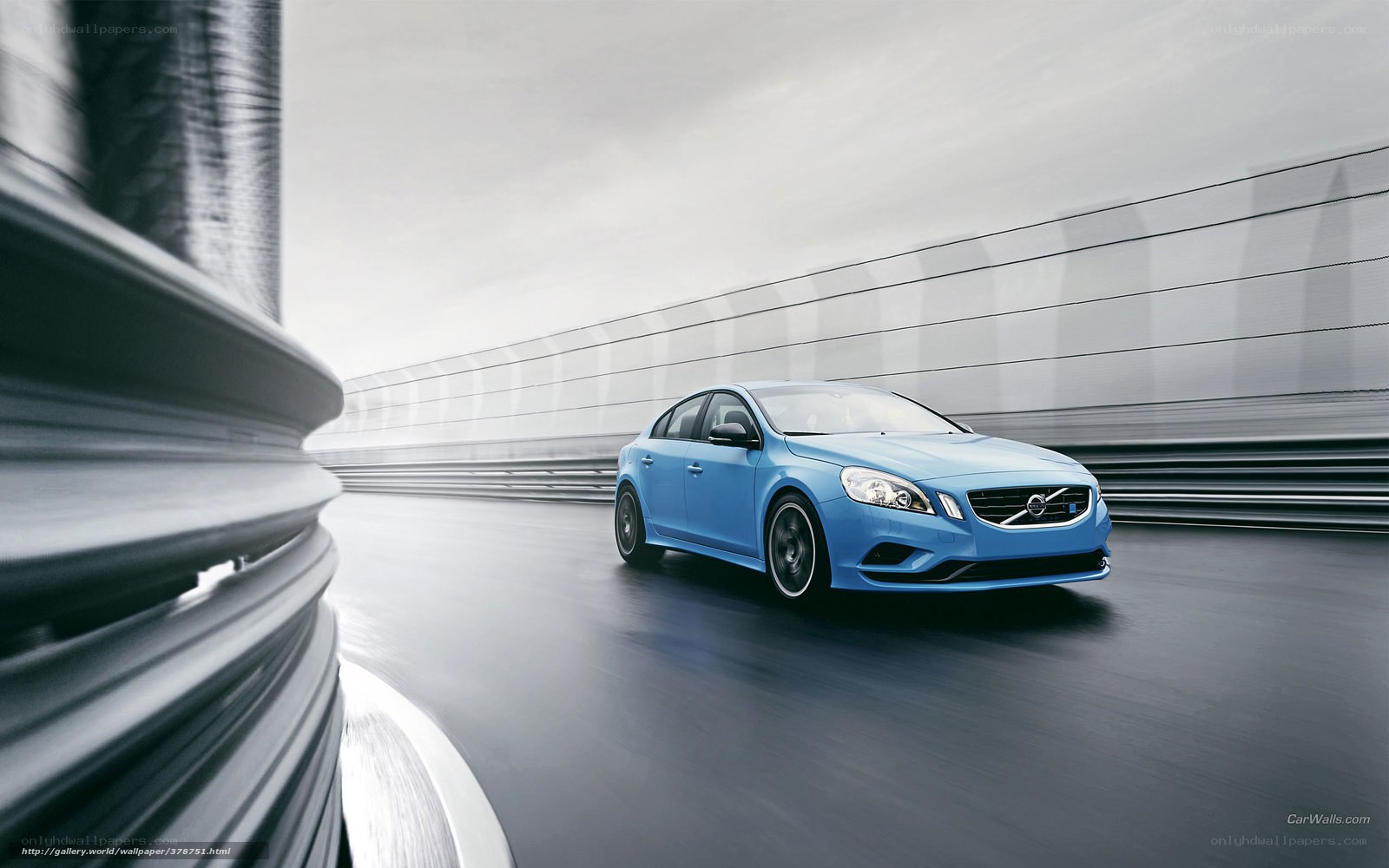 Blue Volvo driving on a track
