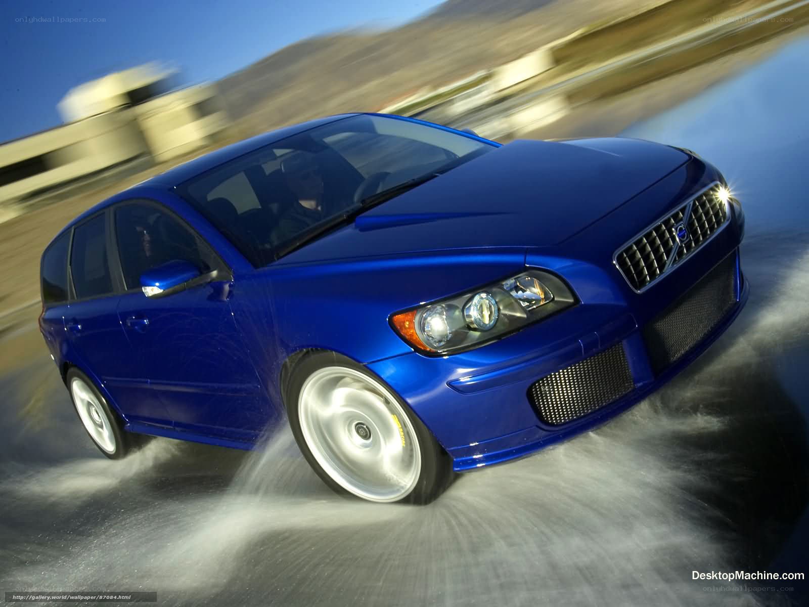 blue volvo in motion