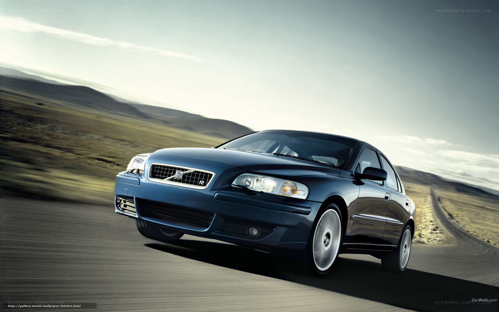 blue volvo on a road
