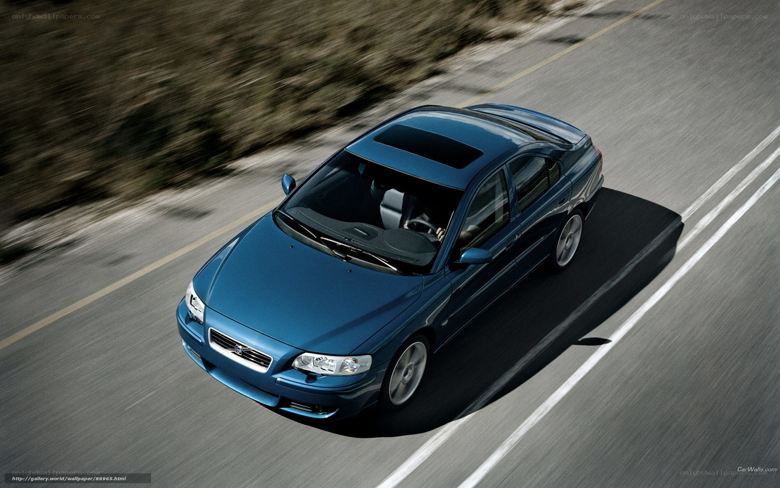 blue volvo on road