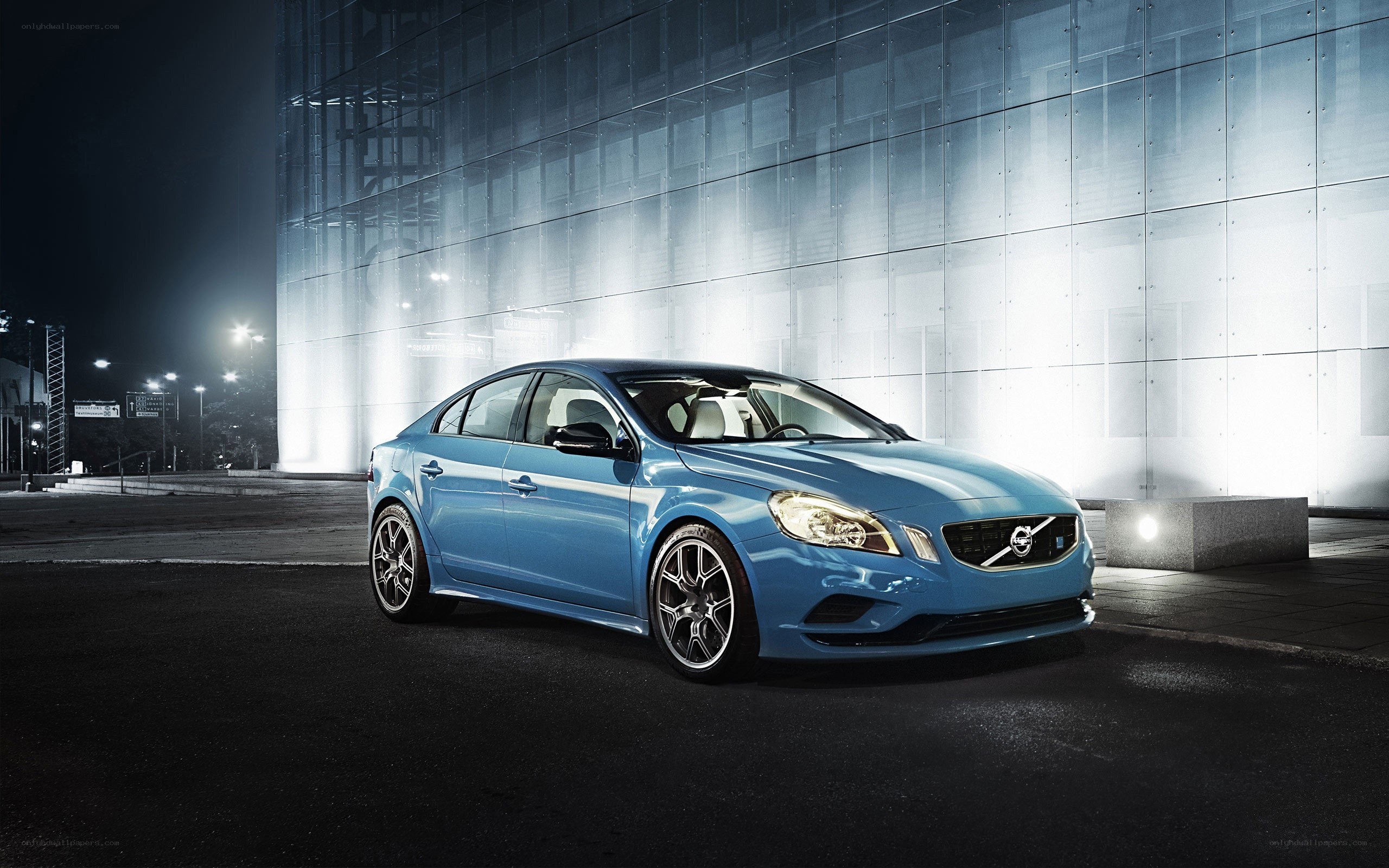 Blue Volvo S60 at night