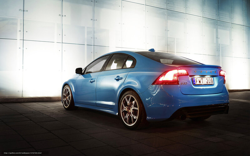 Blue Volvo S60 in modern setting