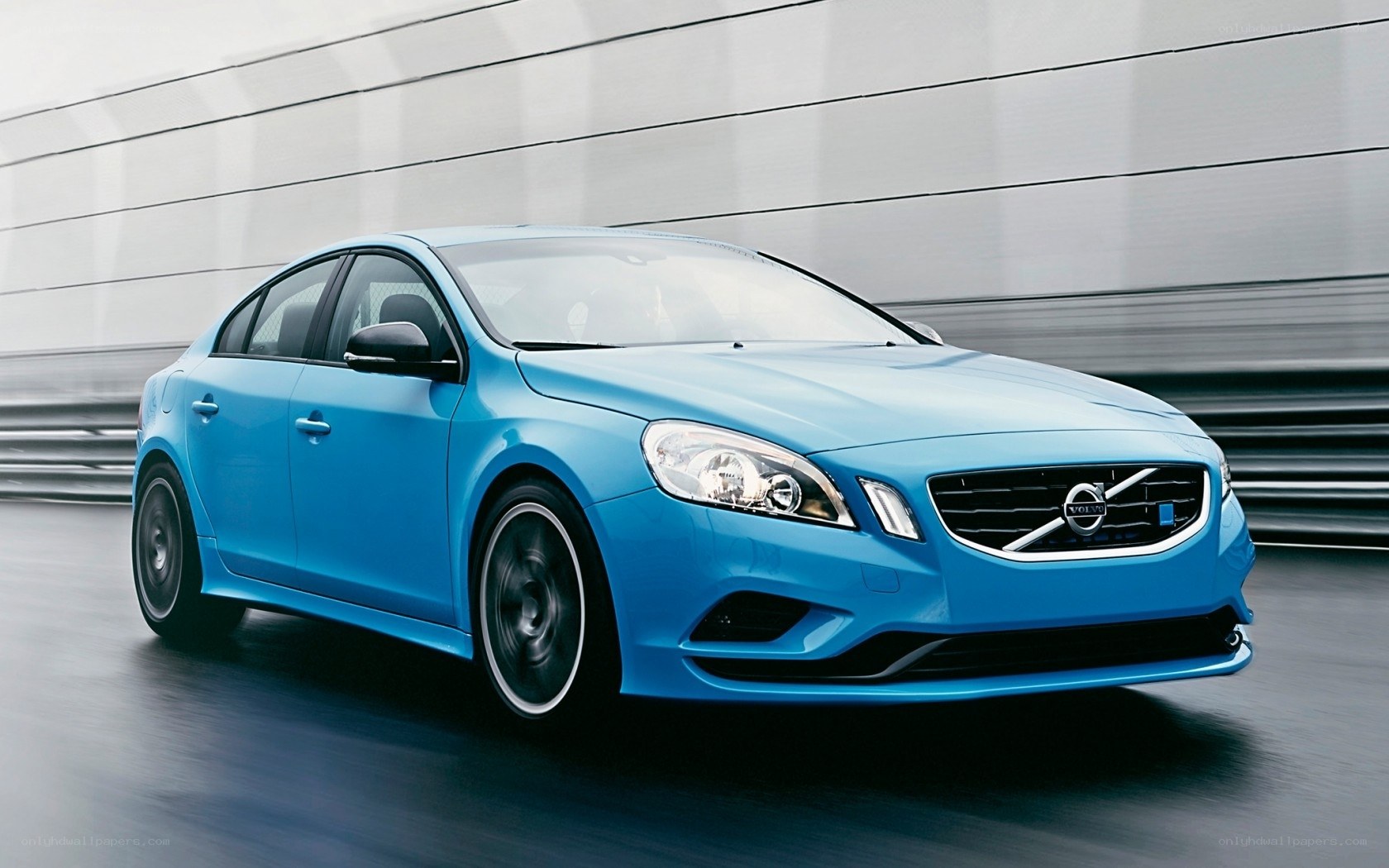 Blue Volvo S60 in motion