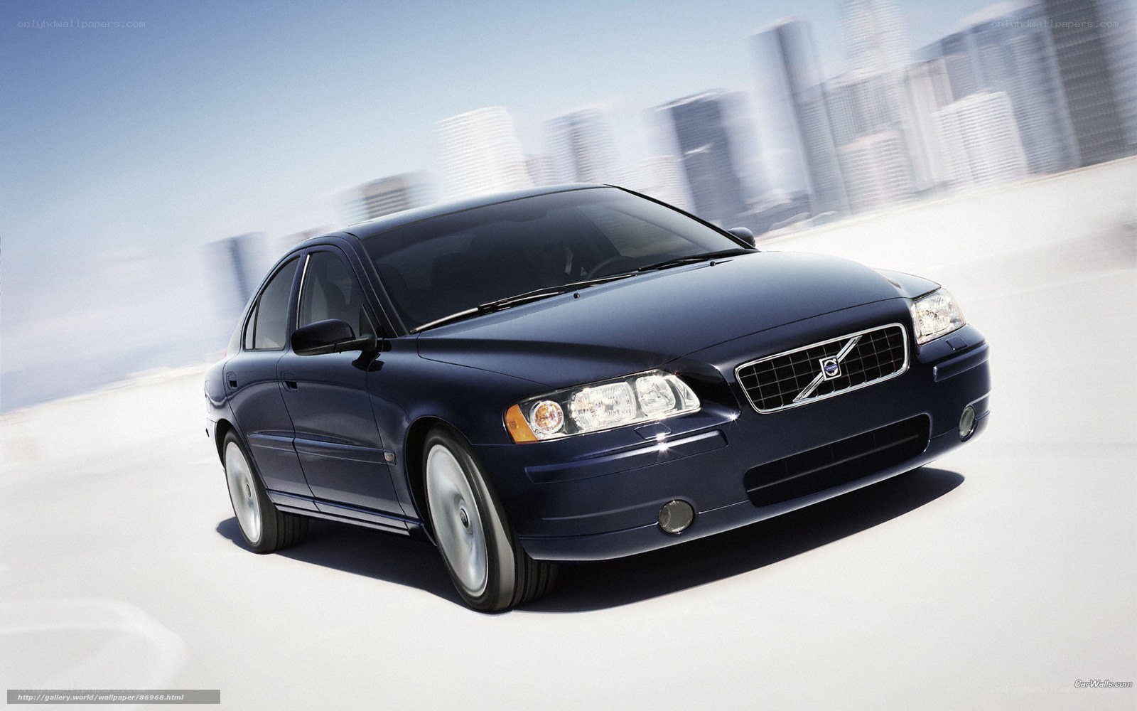 Blue Volvo S60 in motion