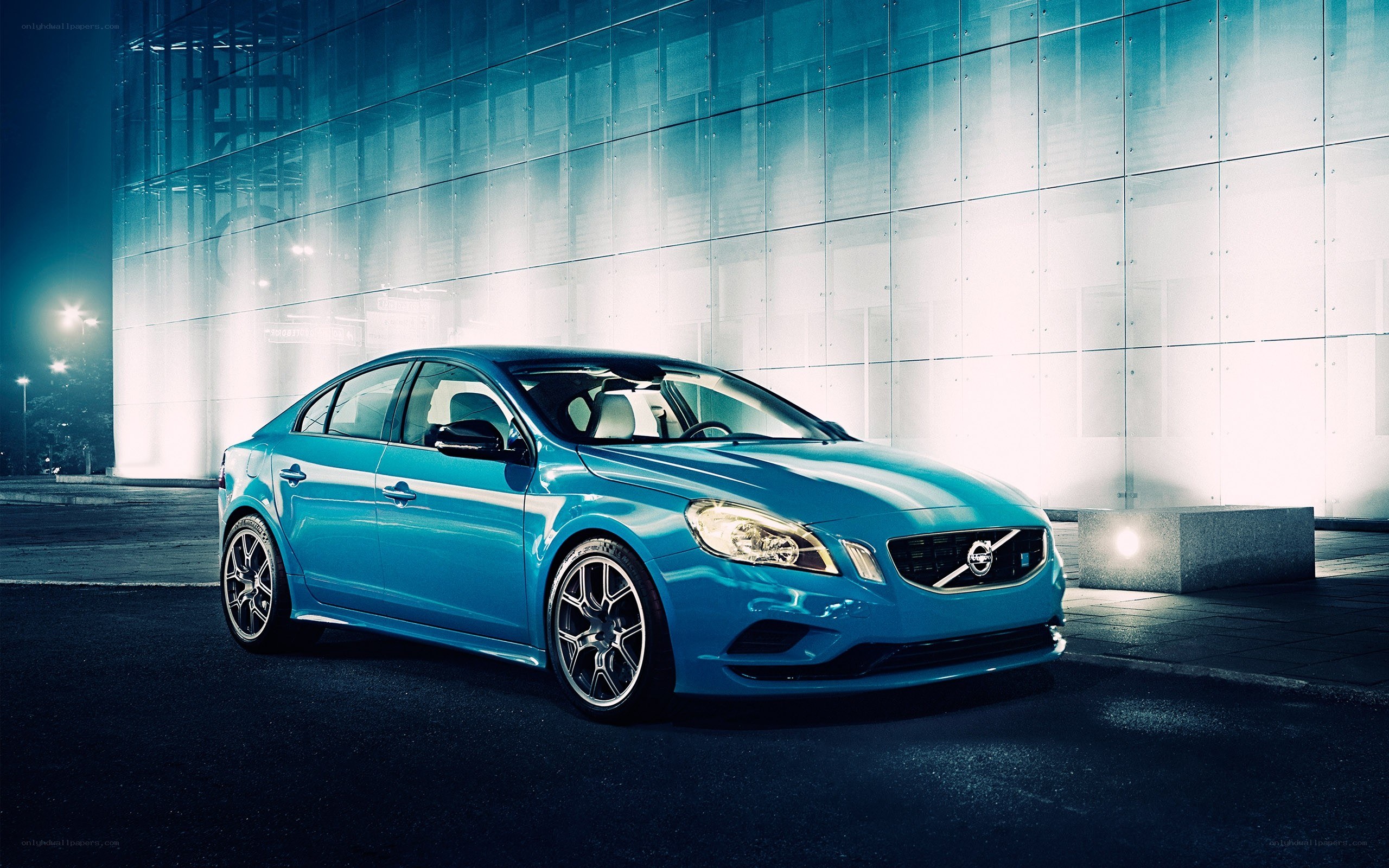 Blue Volvo sedan at night