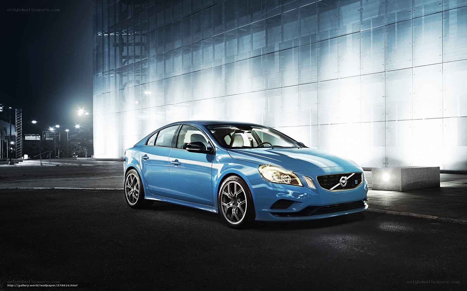 Blue Volvo sedan at night