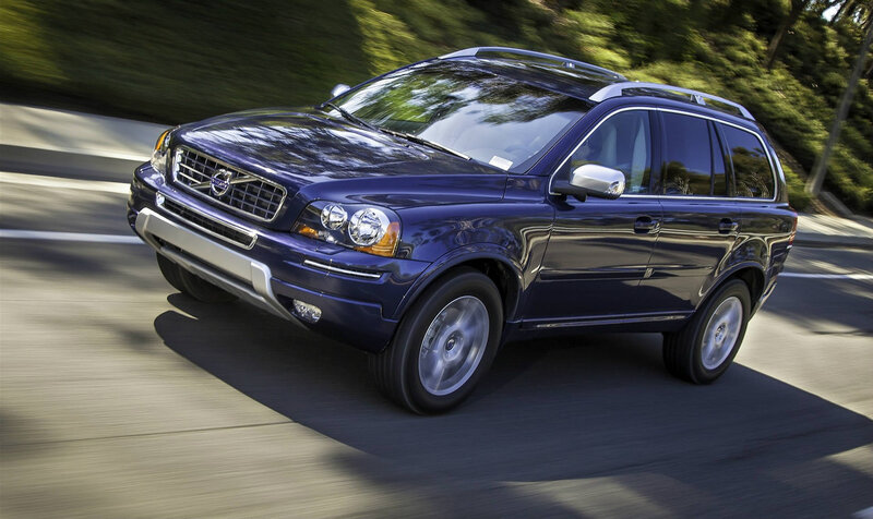 blue volvo suv on road