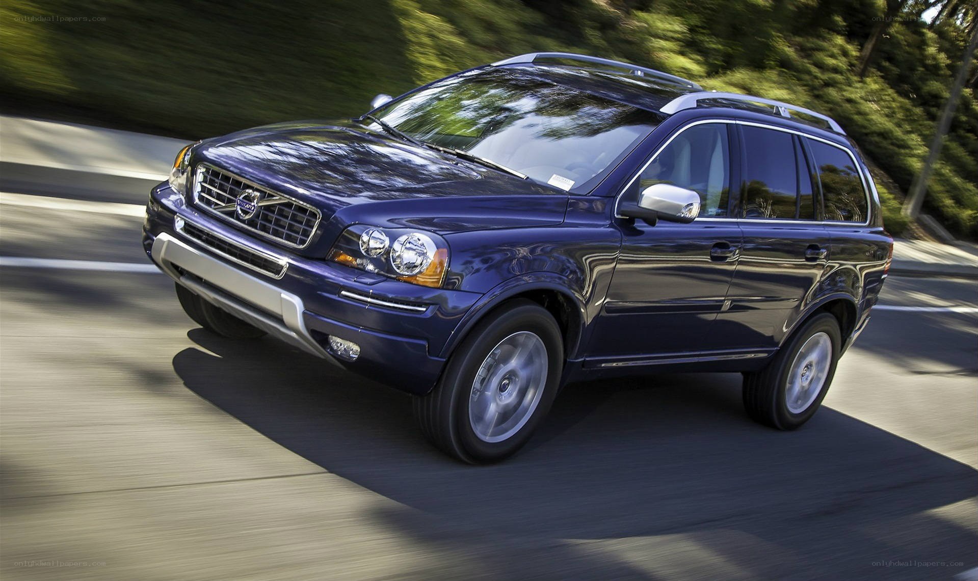 blue volvo suv on road