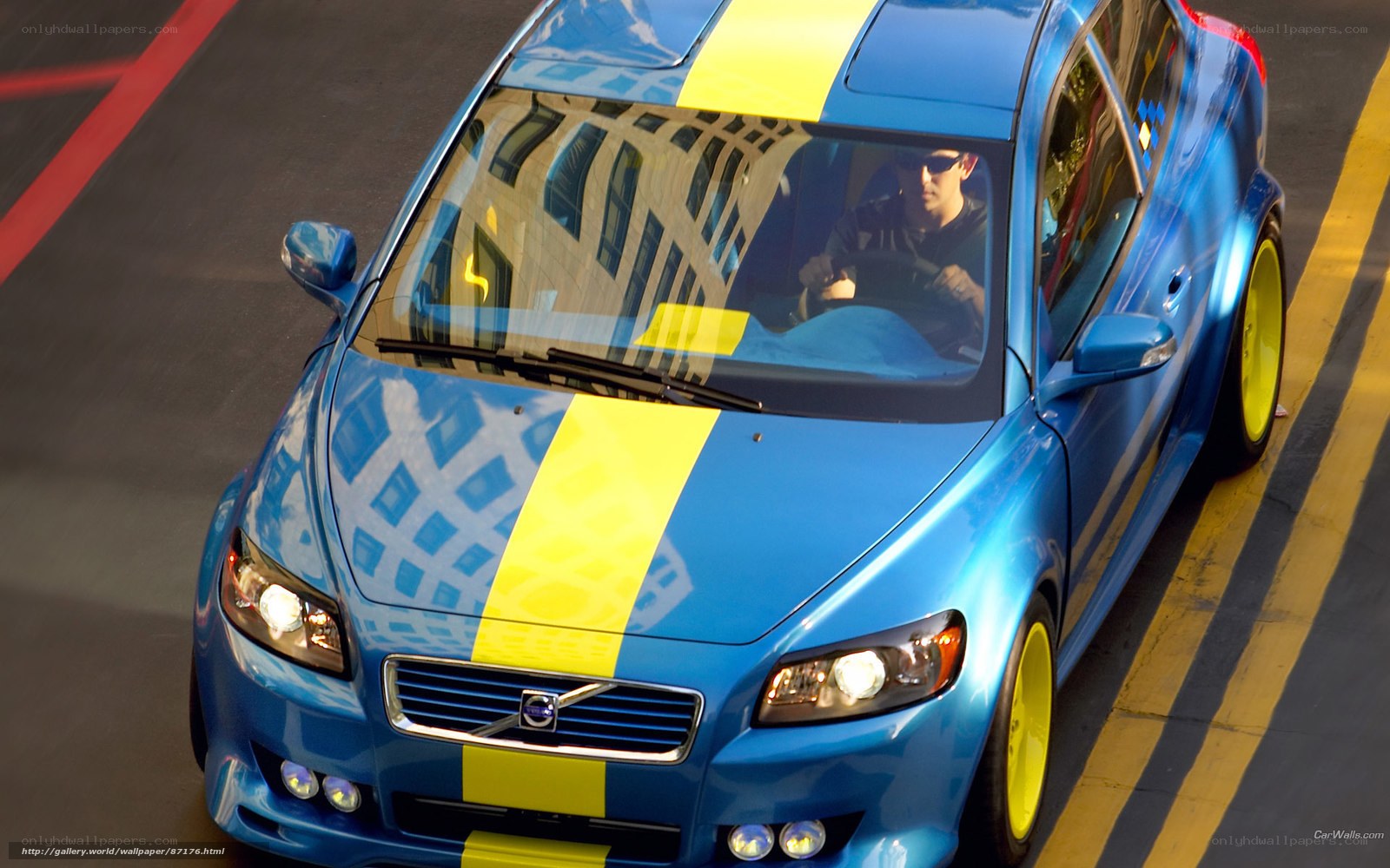 blue volvo with yellow stripes