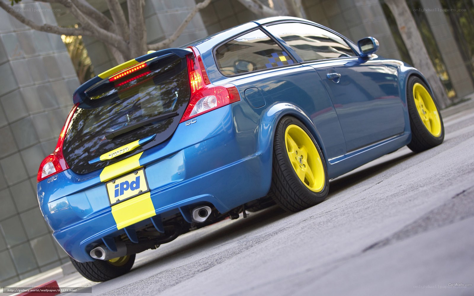 blue volvo with yellow wheels