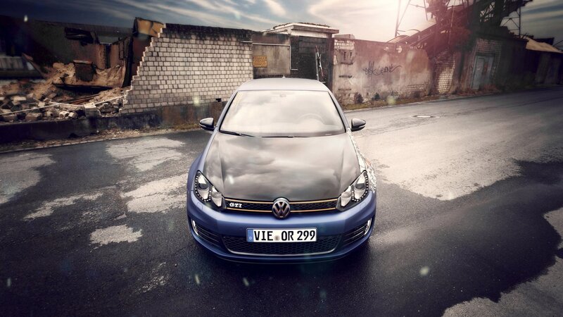 Blue VW GTI in urban setting