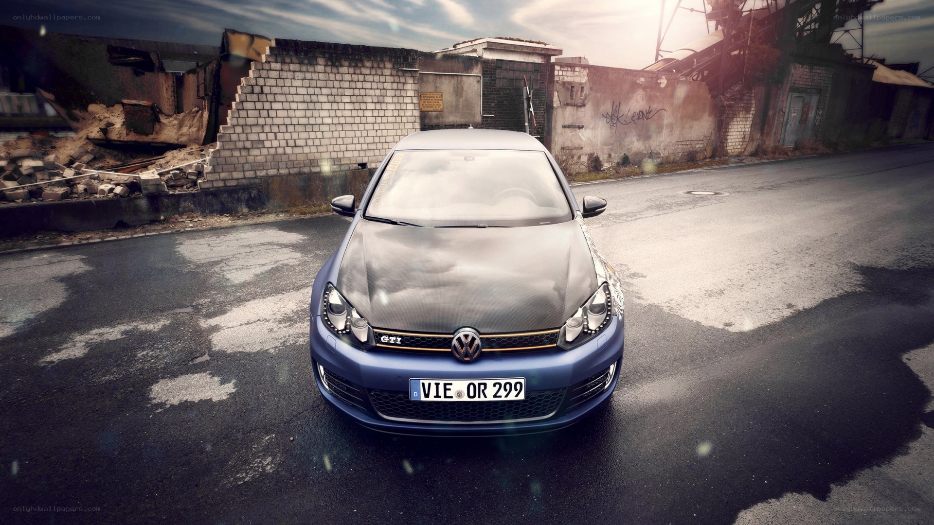 Blue VW GTI in urban setting