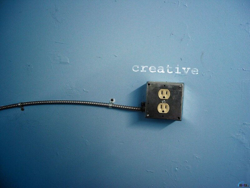 blue wall with electrical outlet