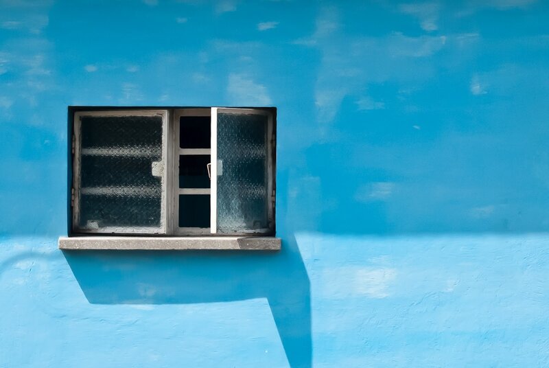 blue wall with open window