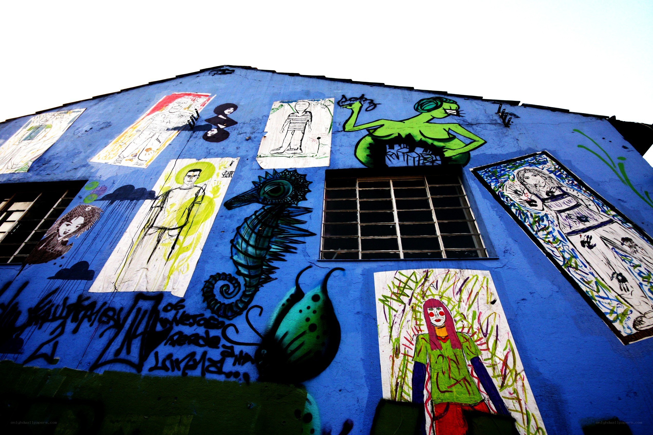 blue wall with street art