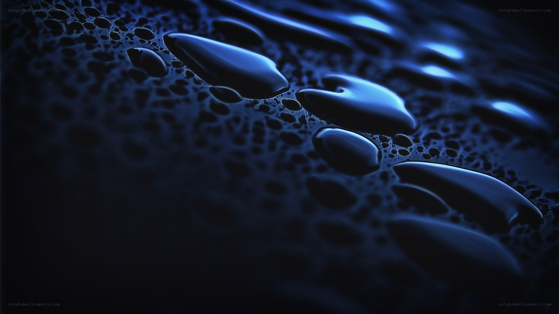 Blue water droplets on dark surface
