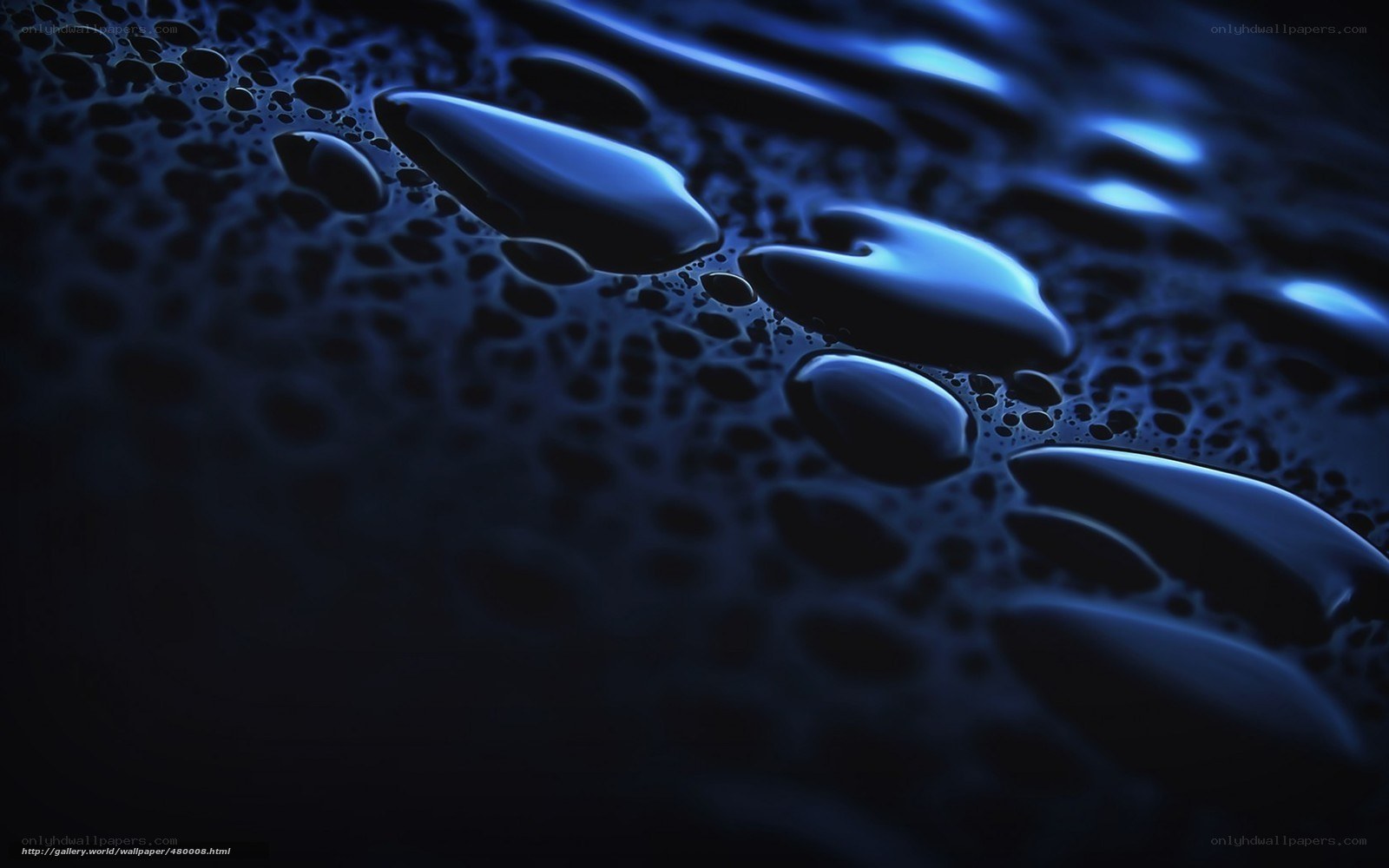 Blue water droplets on dark surface