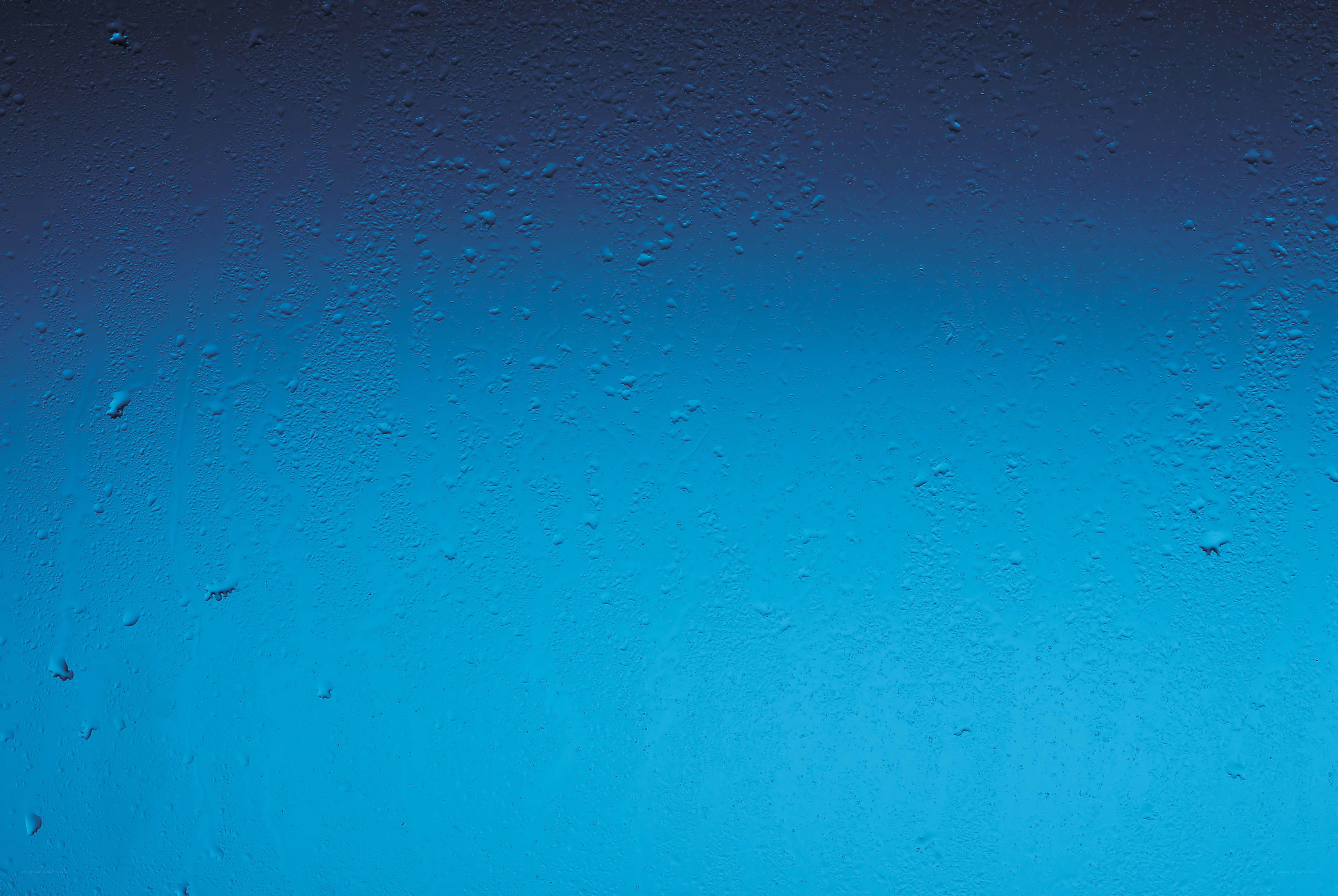 blue water droplets on glass