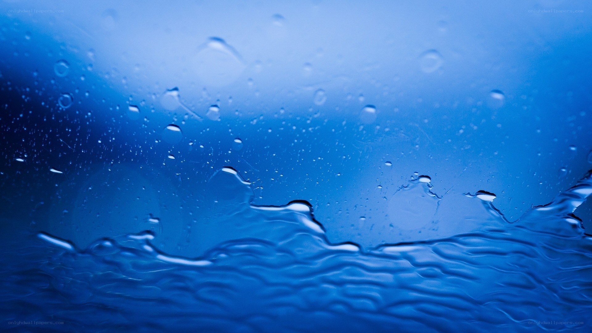 blue water droplets on glass