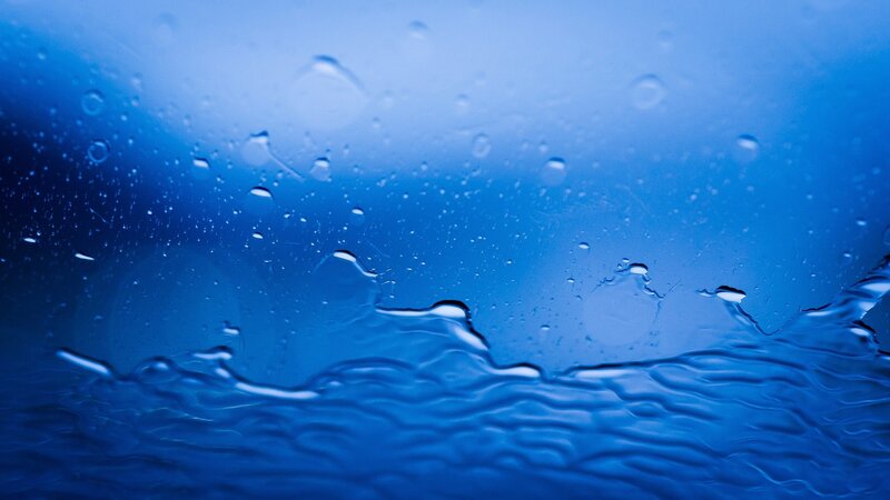 blue water droplets on glass