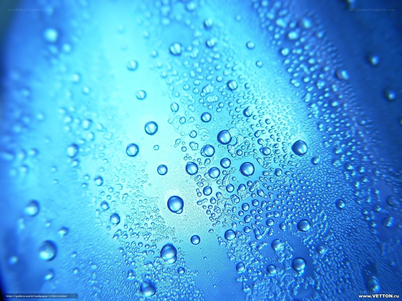 Blue water droplets on glass