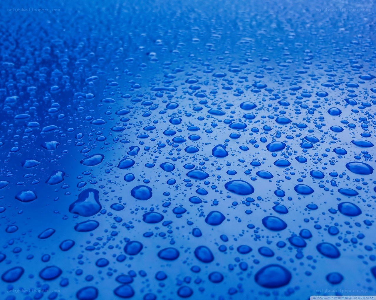 Blue water droplets on surface