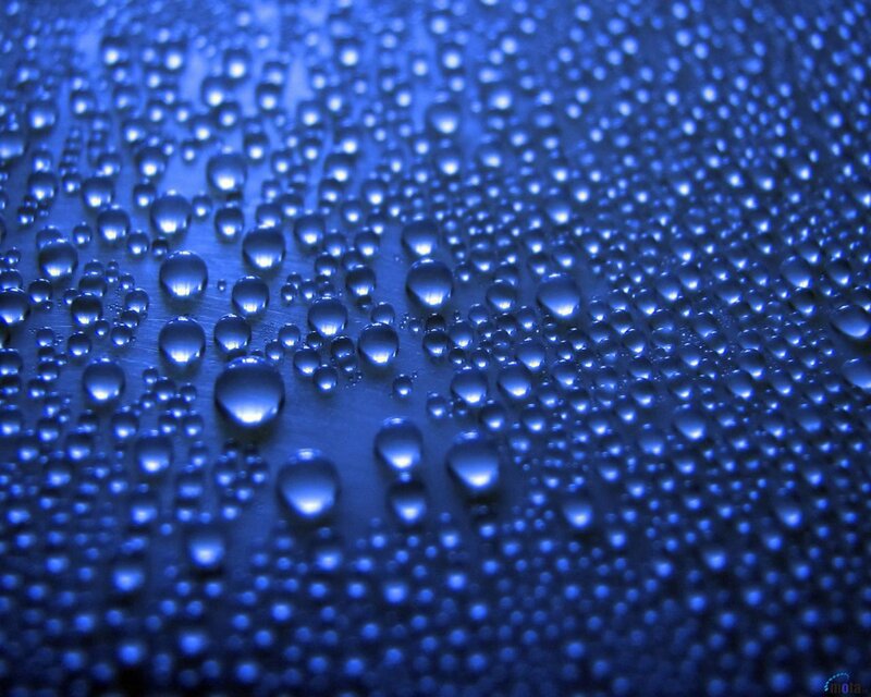 Blue water droplets on surface