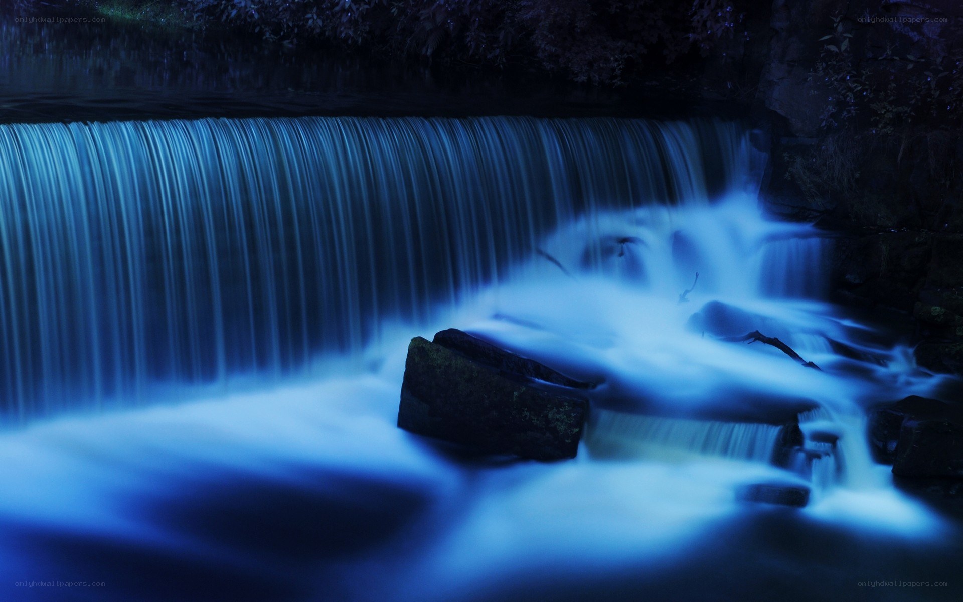 Blue waterfall at night