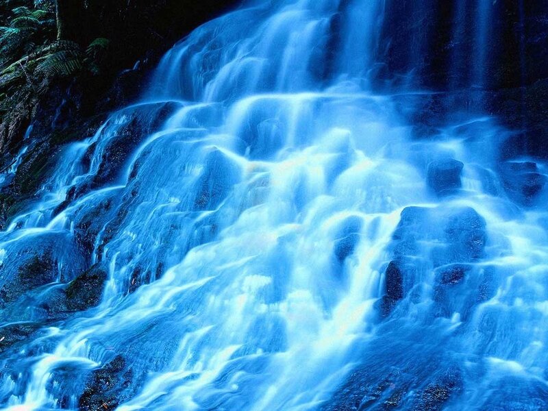 Blue waterfall cascading over rocks