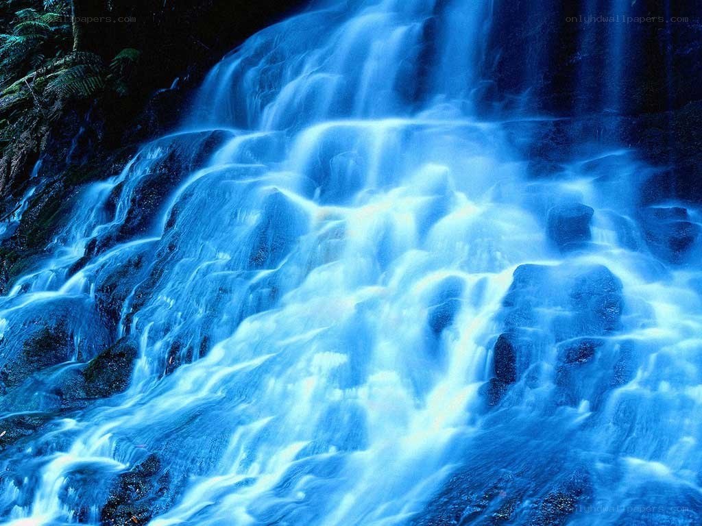 Blue waterfall cascading over rocks