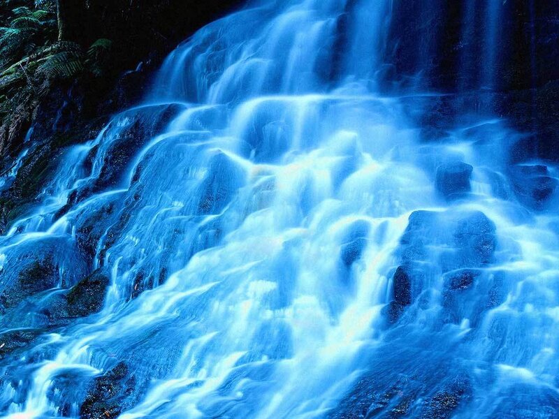 Blue waterfall cascading over rocks