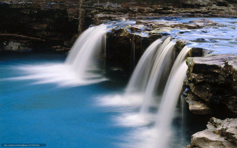 Blue waterfall cascading over rocks