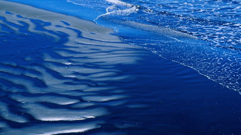 Blue waves on sandy beach