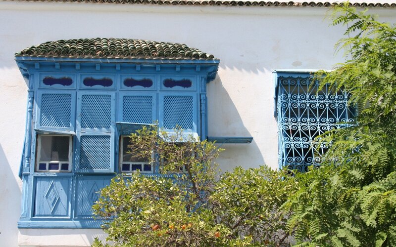Blue window in white building