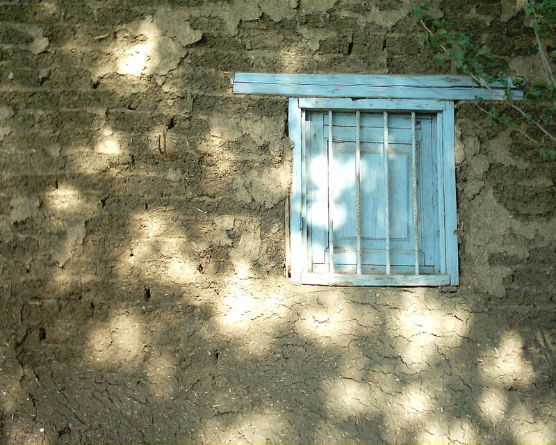 Blue Window on Mud Wall