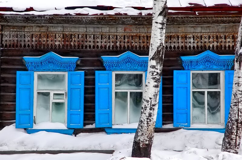 Blue Windows on Wooden House