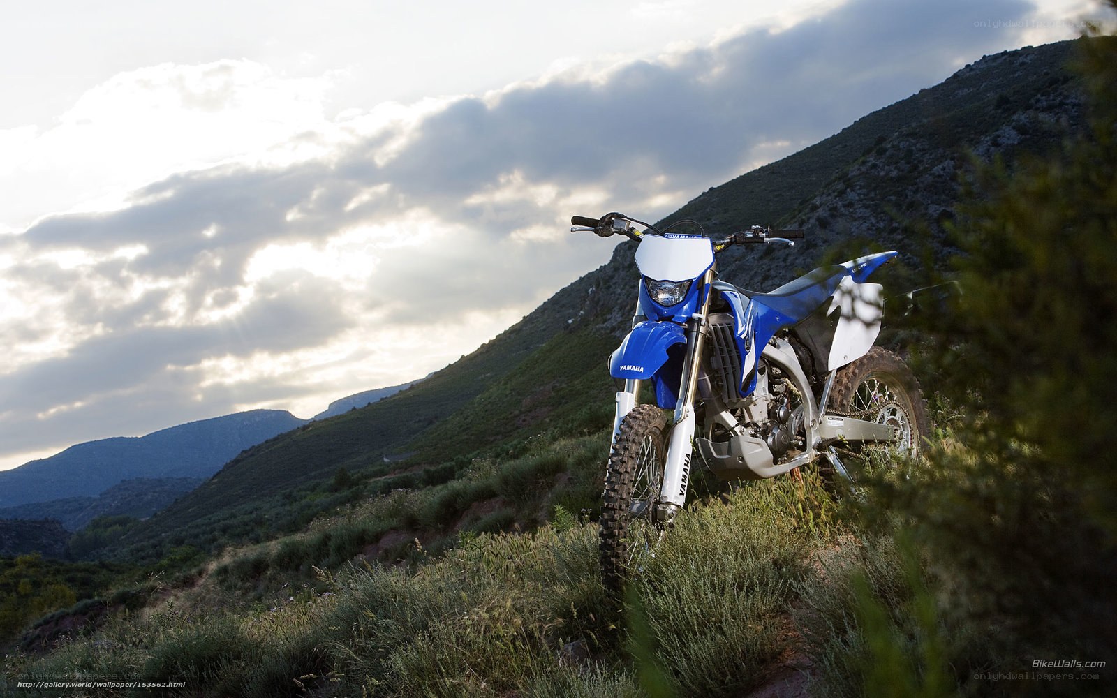 Blue Yamaha dirt bike on hillside