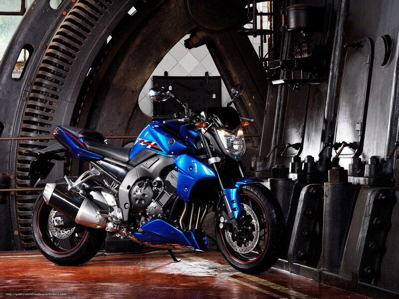 Blue Yamaha motorcycle in industrial setting