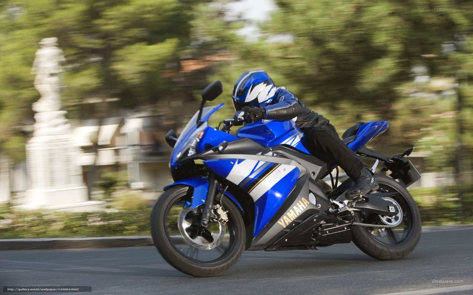Blue Yamaha motorcycle in motion