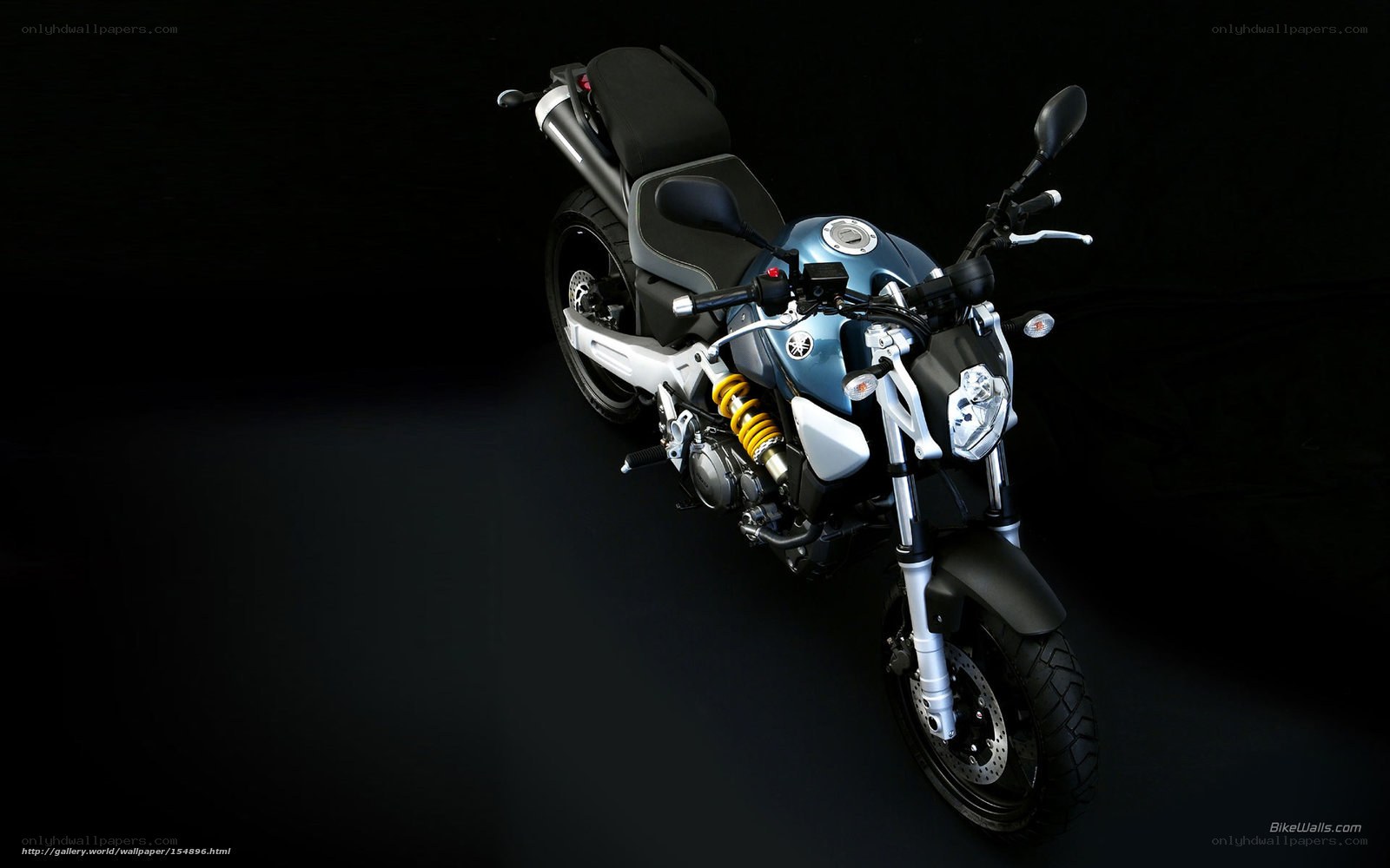 Blue Yamaha motorcycle on black