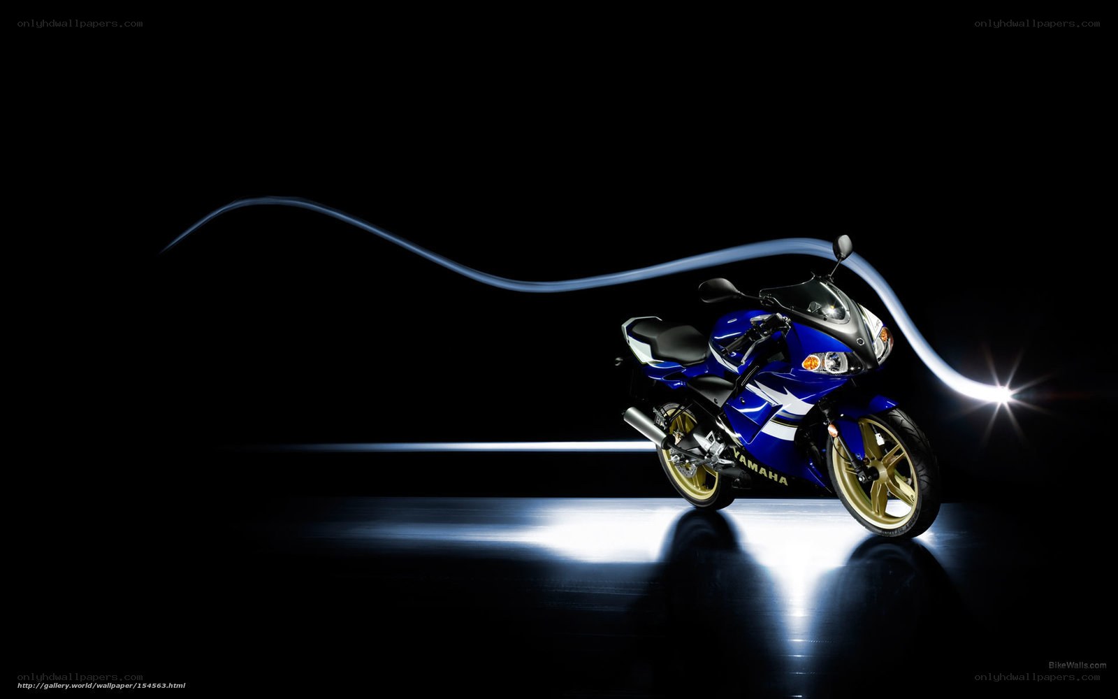Blue Yamaha motorcycle on dark background