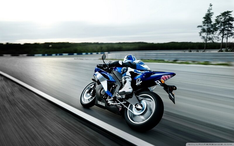 Blue Yamaha motorcycle on track