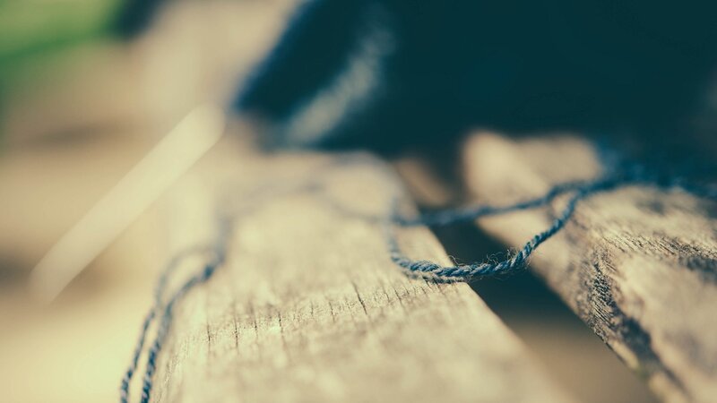 Blue Yarn on Wood