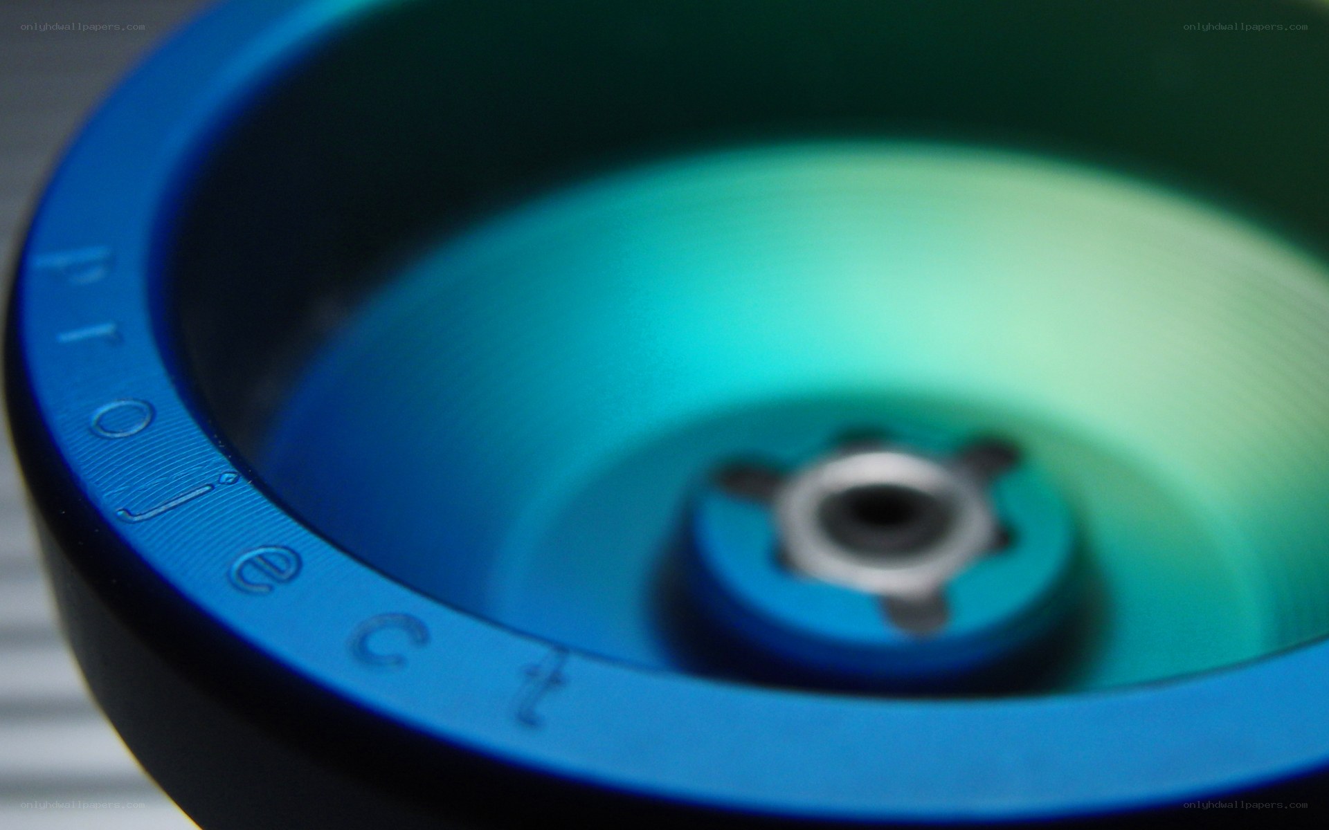 blue yo-yo with green glow