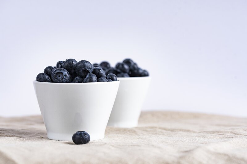 Blueberries in white bowls